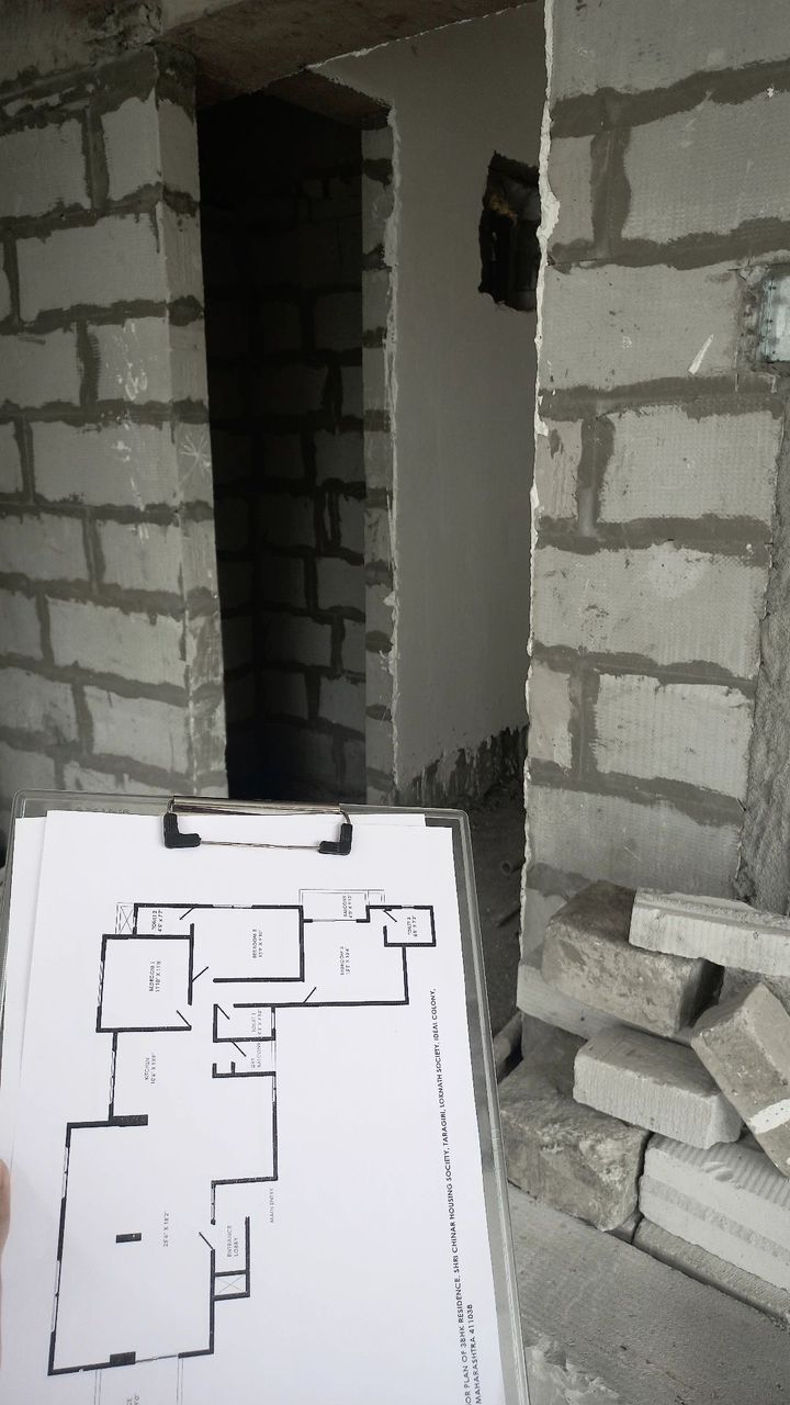Judy Designs site visit with floor plan and construction view